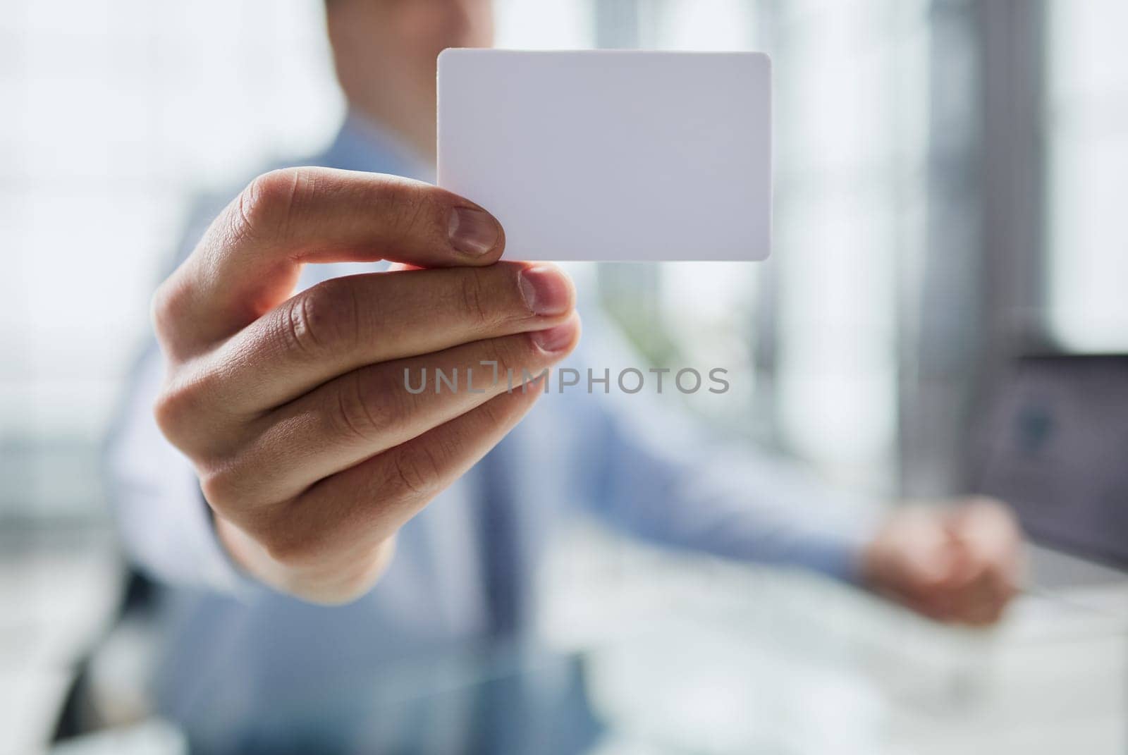 Businessman ,Business Man's hand hold showing business card - close up shot.