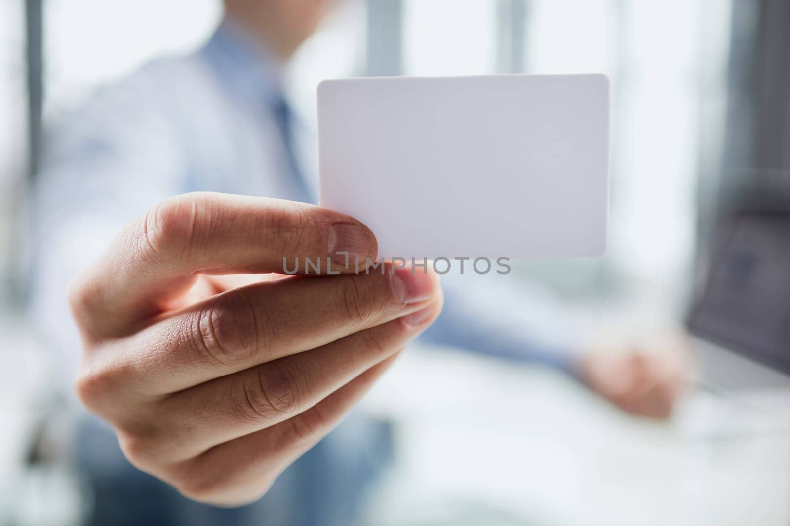 Businessman ,Business Man's hand hold showing business card - close up shot.