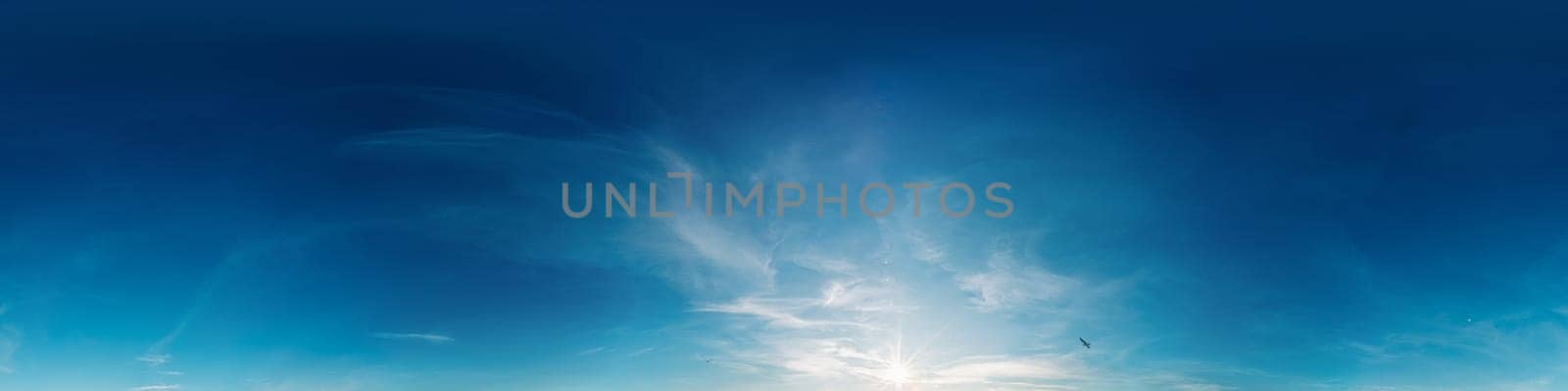 Bright sunset sky panorama with Cirrus clouds. Seamless hdr spherical equirectangular 360 panorama. Sky dome or zenith for 3D visualization, game and sky replacement for aerial drone 360 panoramas.