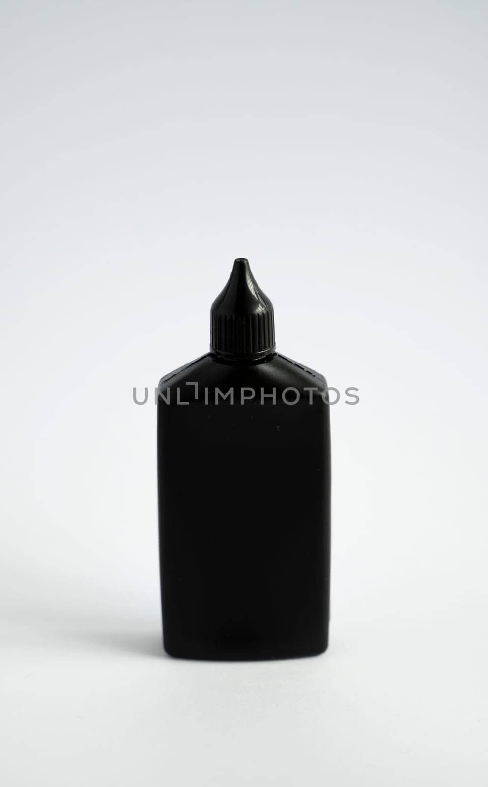 Mock up unbranded black bottle of finish line dry bicycle lubricant with teflon. Bicycle care, bicycle chain care