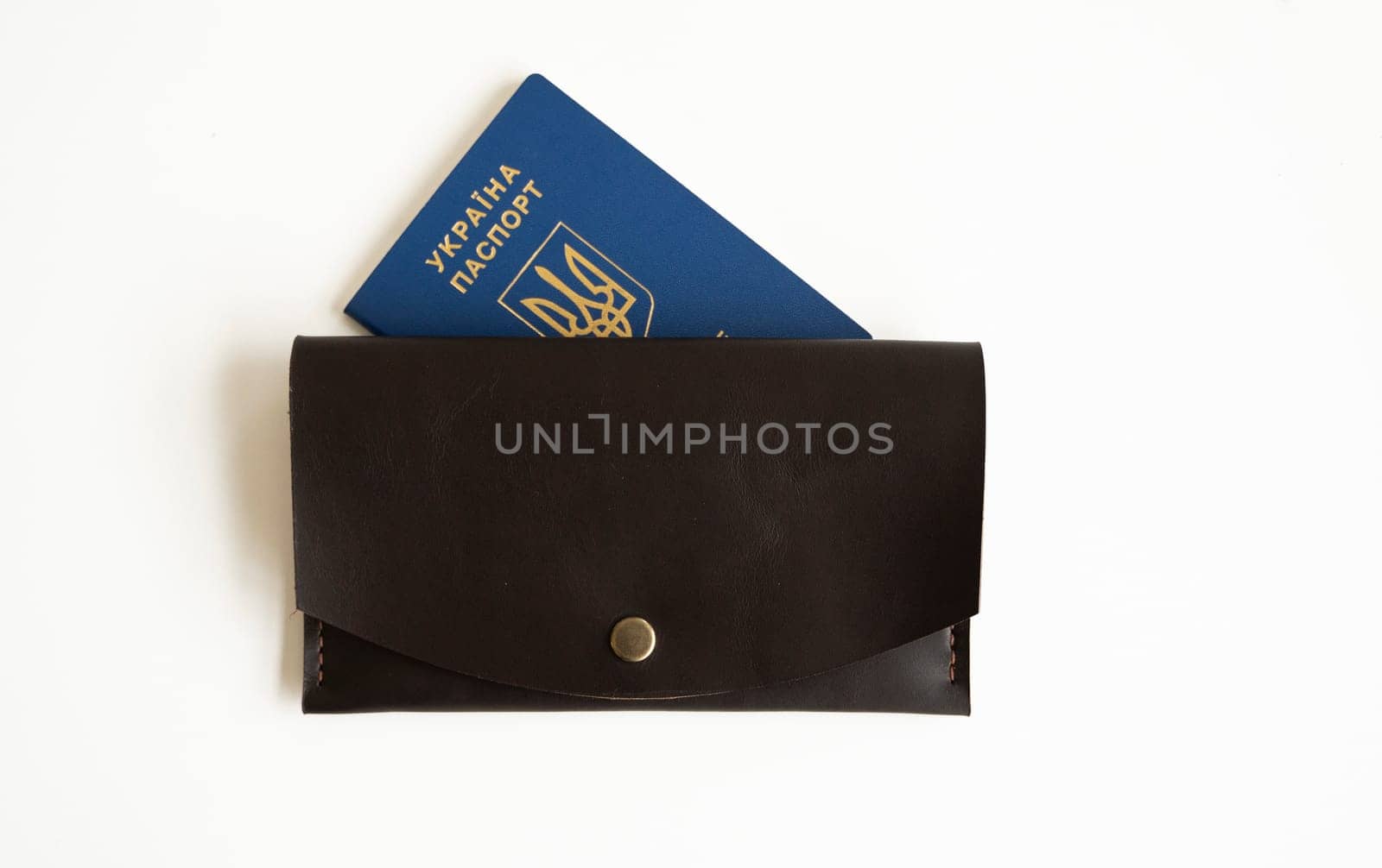 Ukrainian passport with a leather wallet on a white background. by vovsht