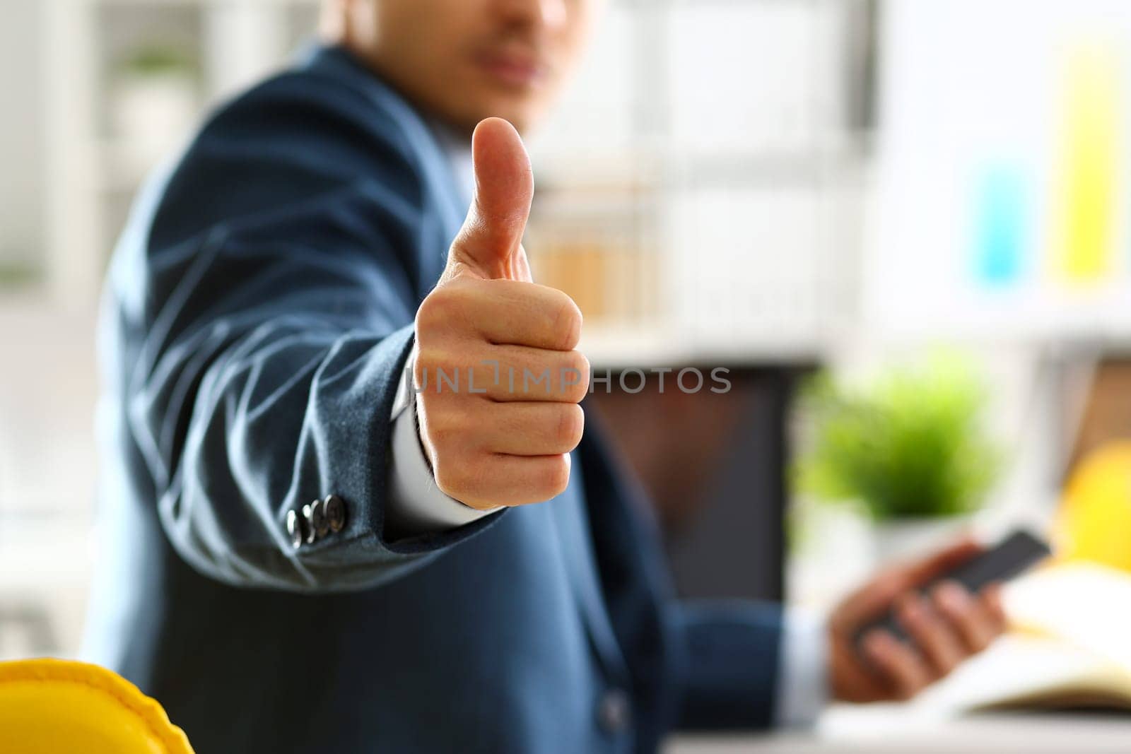 Male arm show OK or confirm during conference in office closeup. High level and quality product offer okay symbol expression perfect mediation solution happy client creative adviser participate