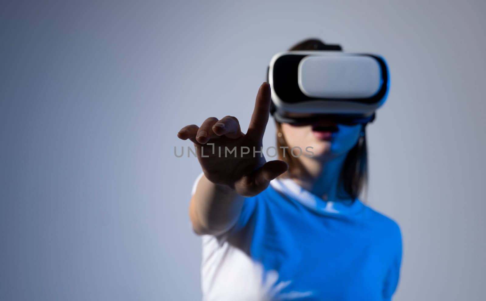 Female engineer wearing virtual reality headset designing a new pruducts or technologis using VR technology. Development and prototyping software