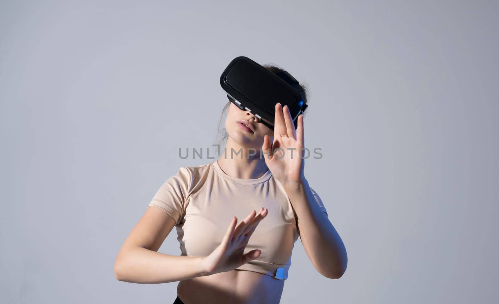 Female engineer wearing virtual reality headset designing a new pruducts or technologis using VR technology. Development and prototyping software. by vovsht