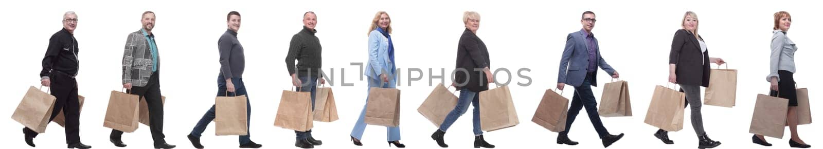 a line of people with shopping bags. side view by asdf
