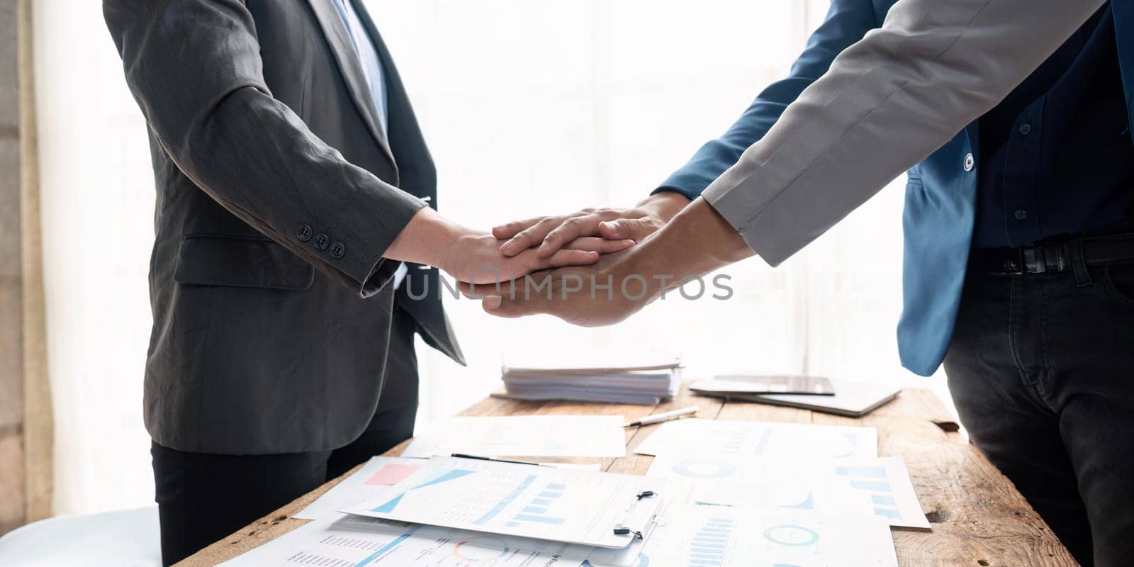 Business teamwork join hands together. group of young people putting their hands. Teamwork Join Hands Support Together Concept. by nateemee