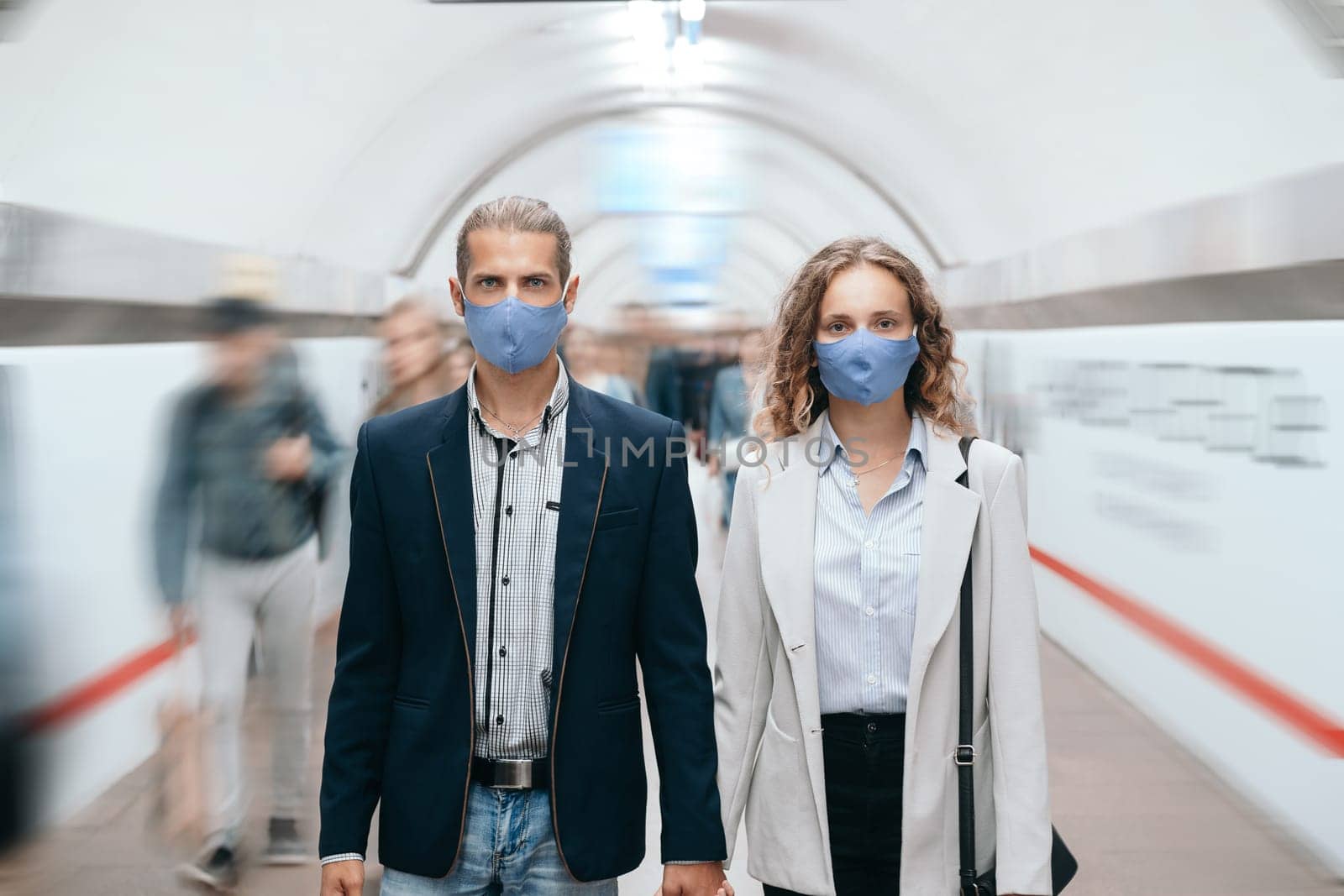 close up. man and a woman walking along the platform in subway .