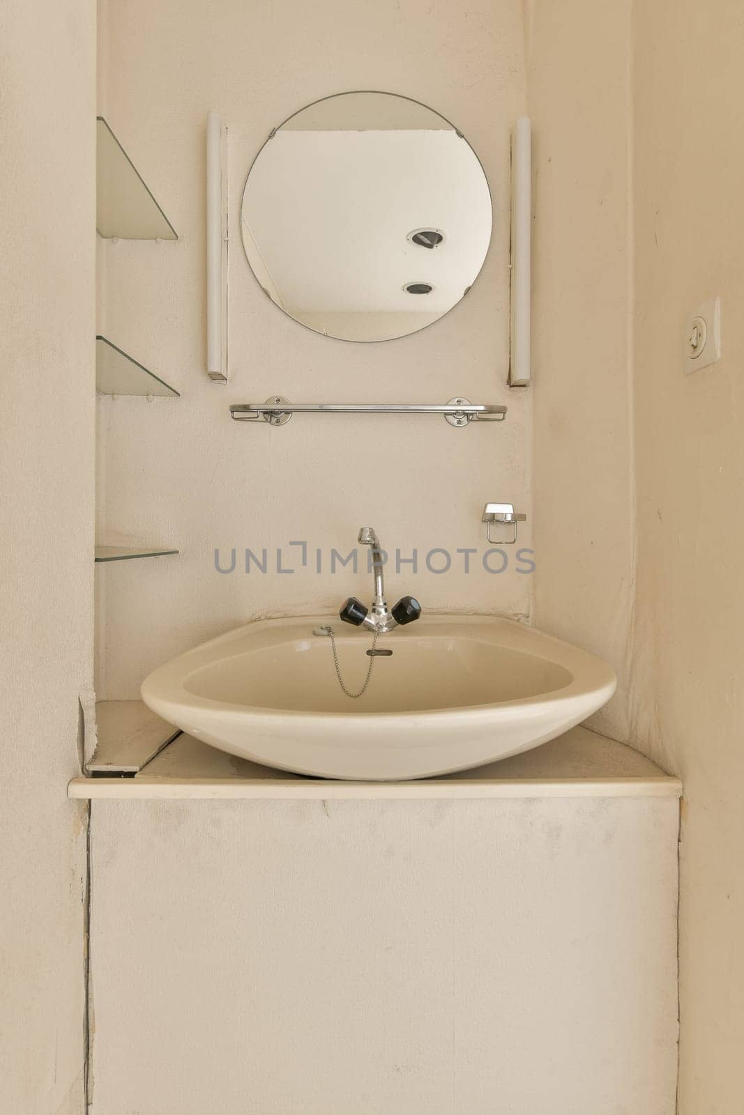 a bathroom with a sink and mirror on the wall next to it is an open door that has been painted white
