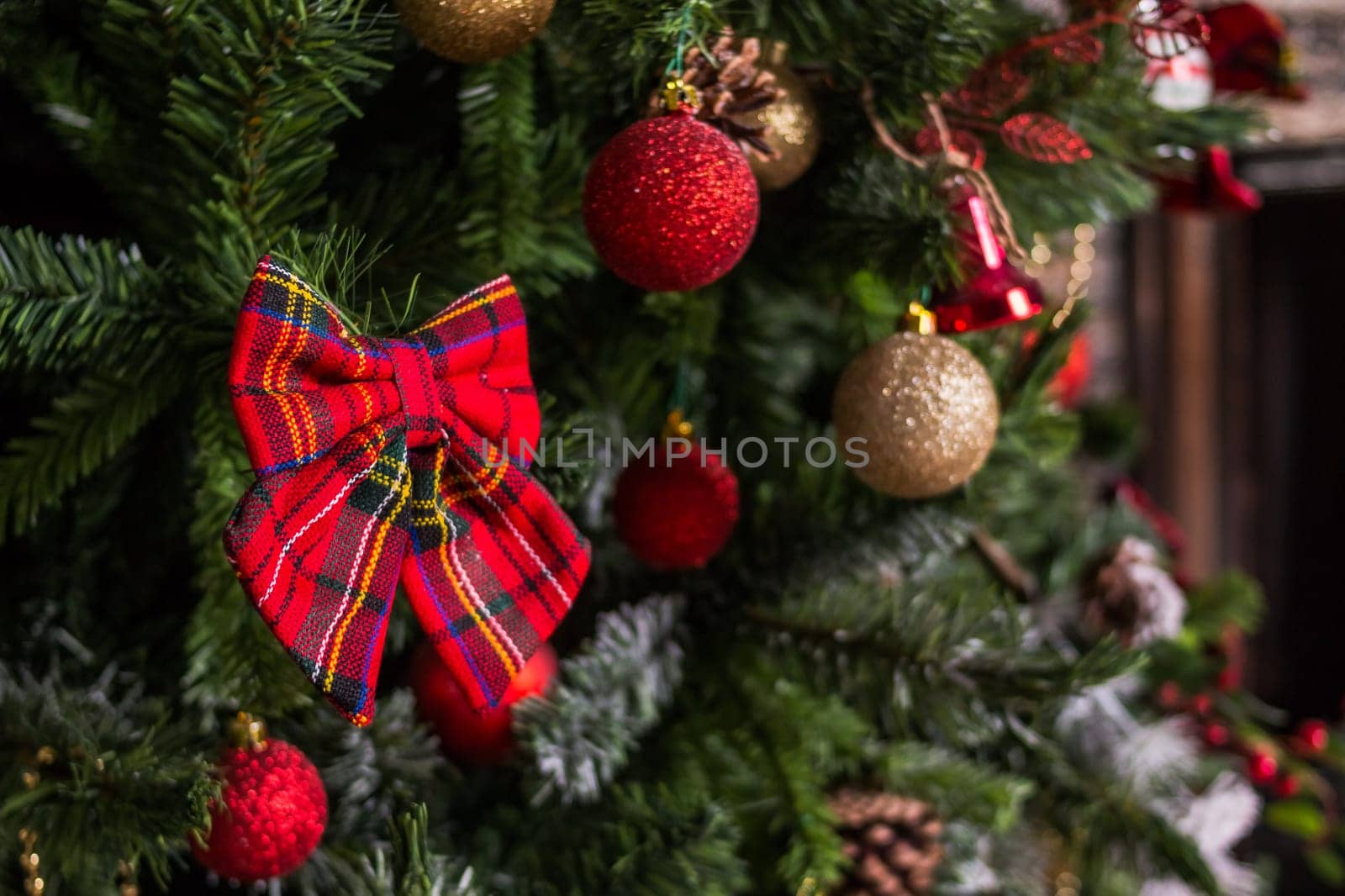 Christmas and New Year Decoration. Baubles hanging on Christmas Tree. Xmas holiday background with garlands, tinsel, ball.