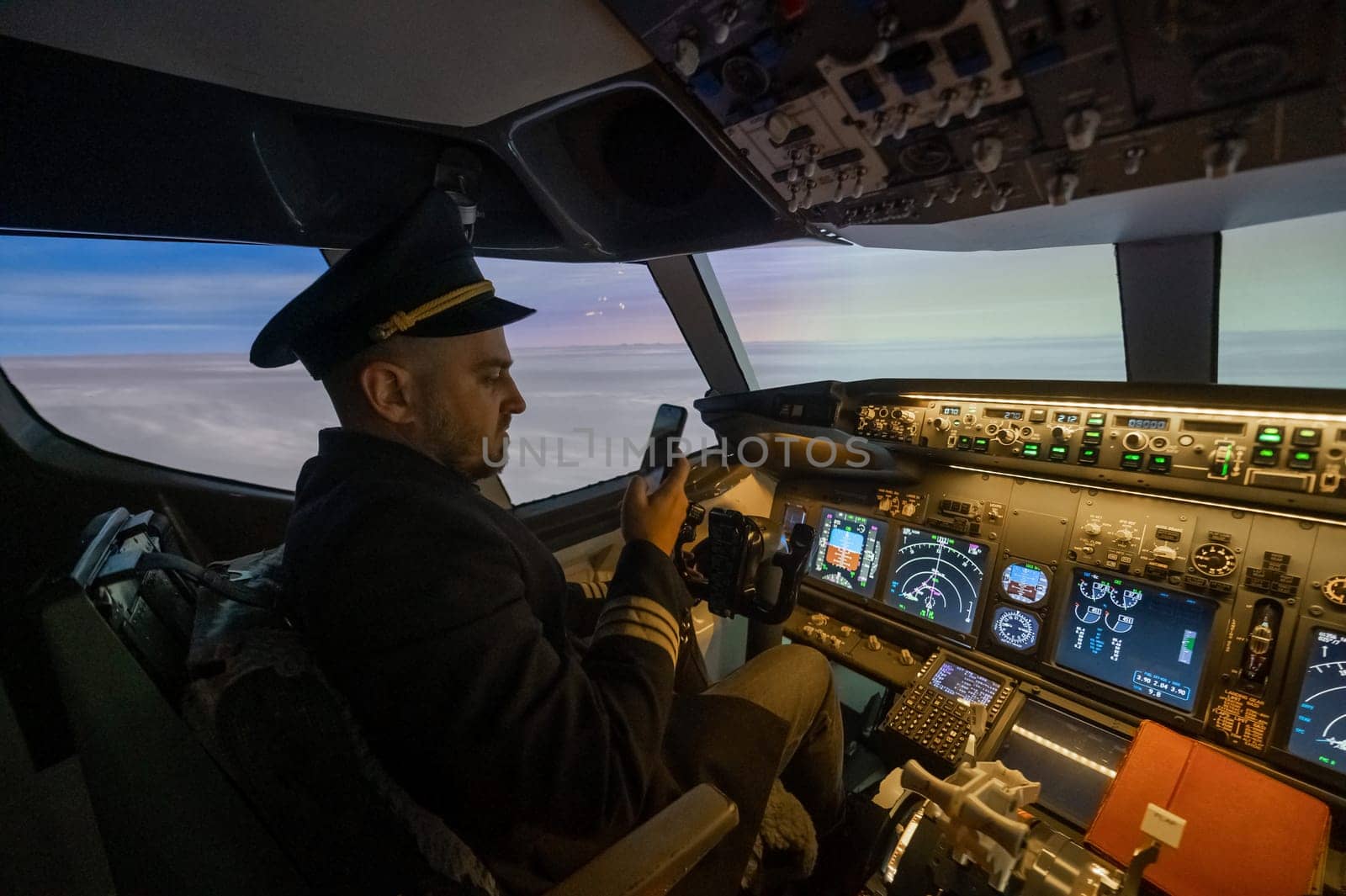 The pilot uses a smartphone while flying the plane. Autopilot