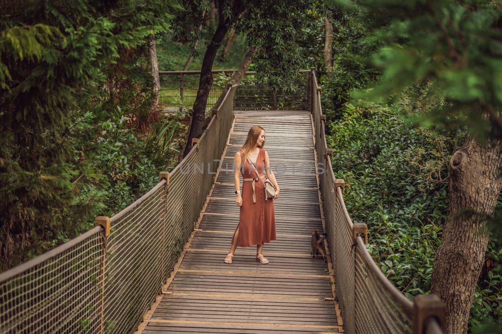 Woman tourist in Rope bridge in Yildiz Park. Besiktas, Istanbul, Turkey. Turkiye.