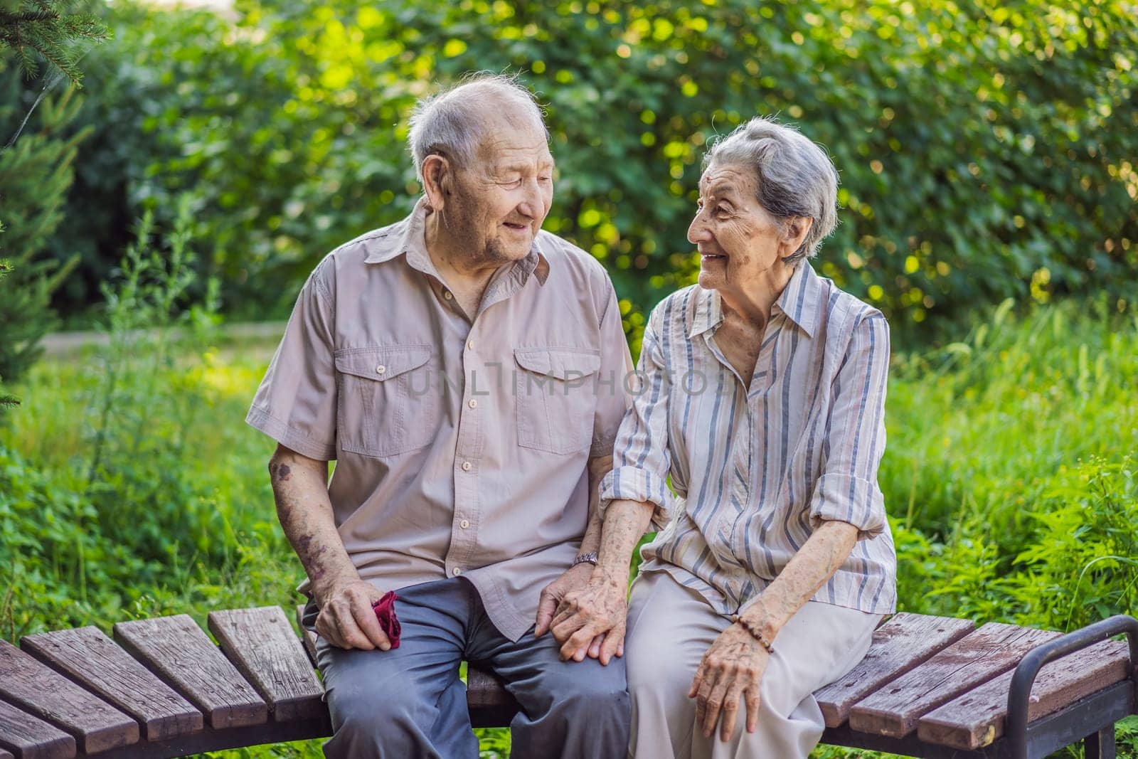 Elderly couple in love. Senior husband and wife holding hands and bonding with true emotions.