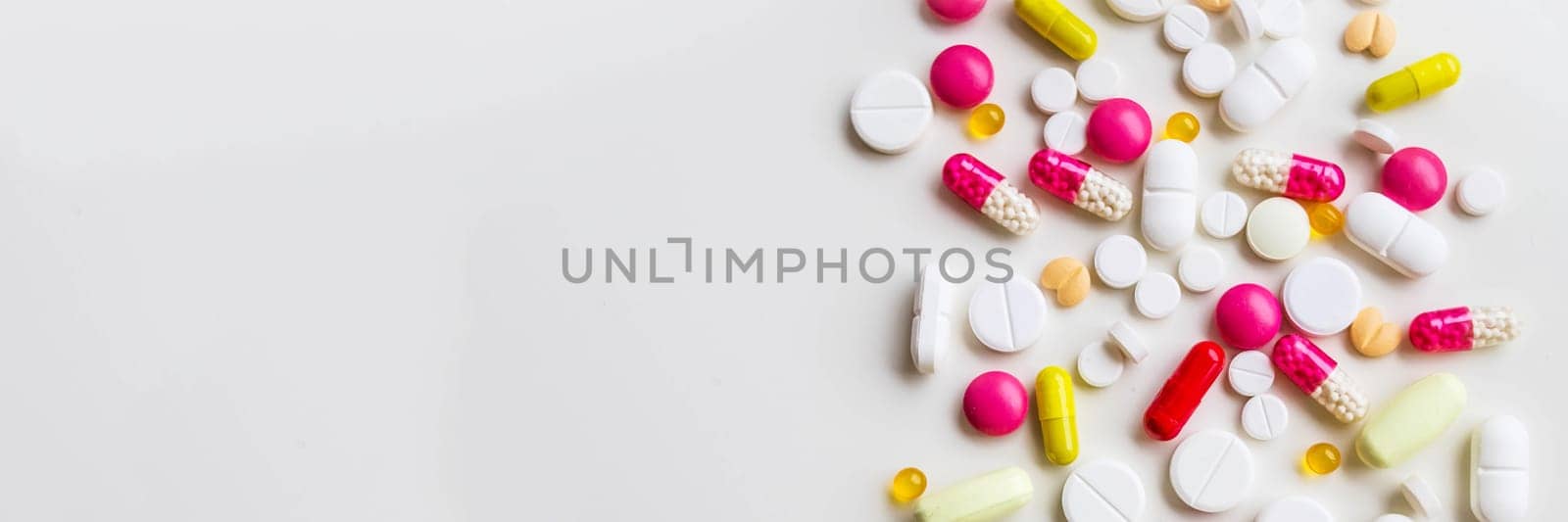 Frame of colorful antibiotic capsule pills. Pile of antibiotic capsule pills. Antibiotic drug resistance concept. Prescription drug.