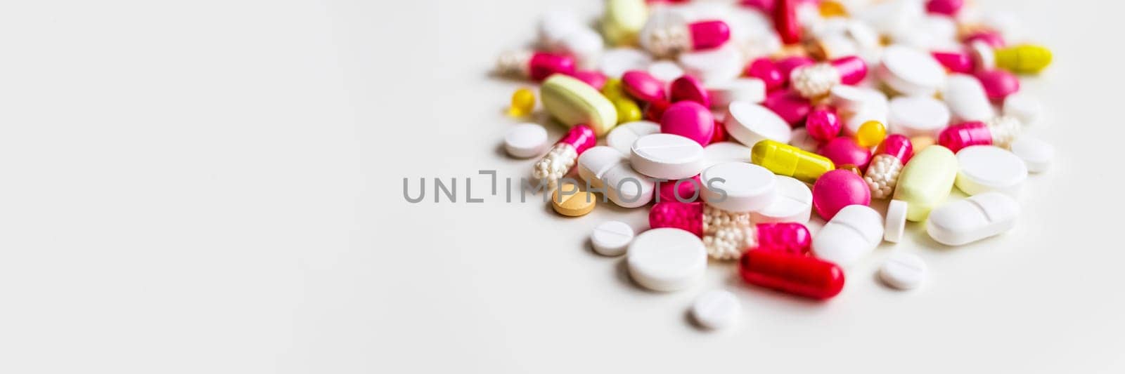 Frame of colorful antibiotic capsule pills. Pile of antibiotic capsule pills. Antibiotic drug resistance concept. Prescription drug.