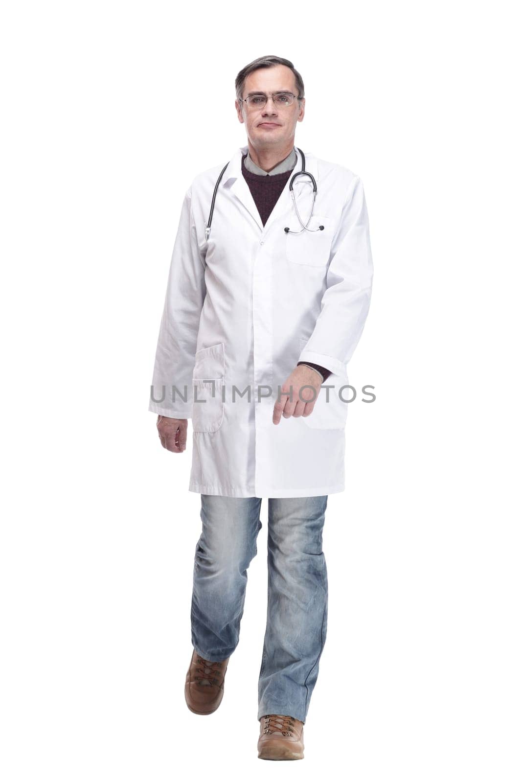 qualified doctor with stethoscope going forward. isolated on a white background.