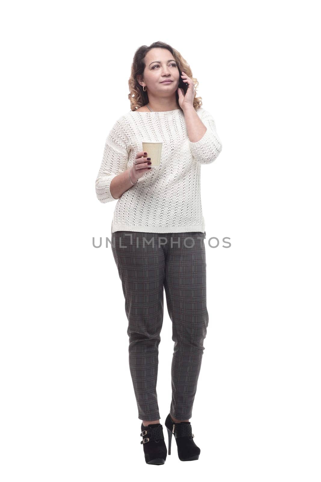 young woman with a smartphone and a takeaway coffee. isolated on a white background.