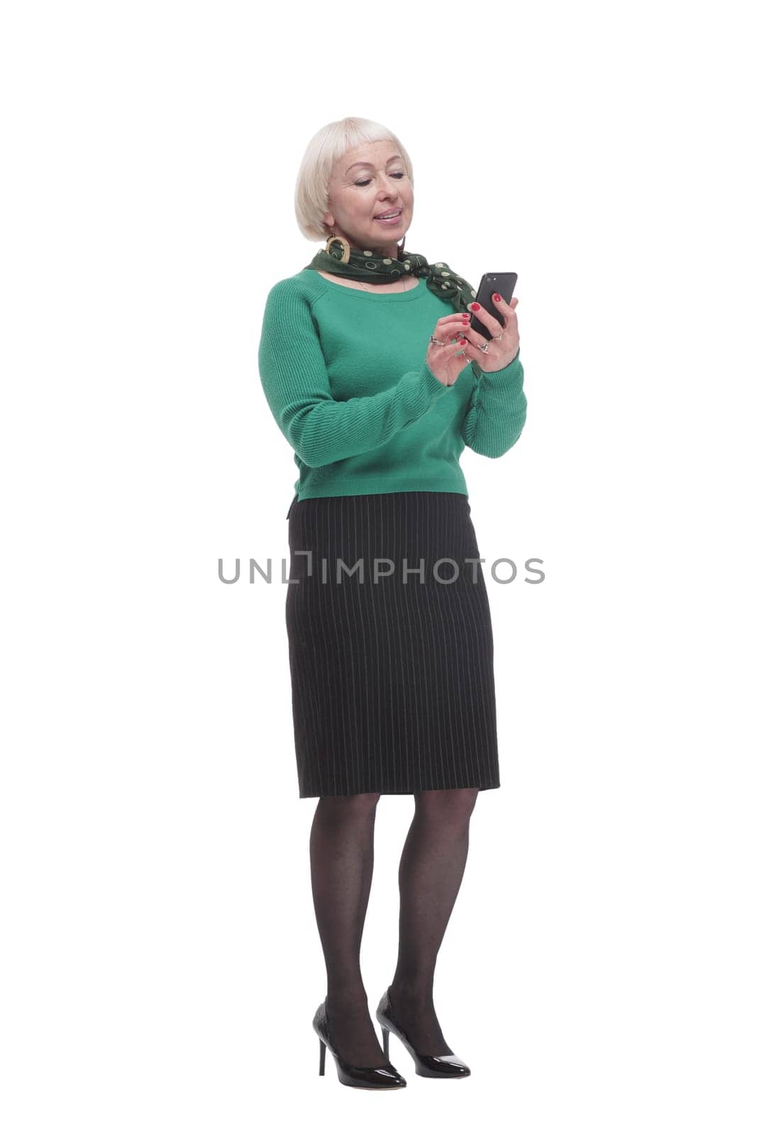 in full growth. attractive woman with a smartphone. isolated on a white background.