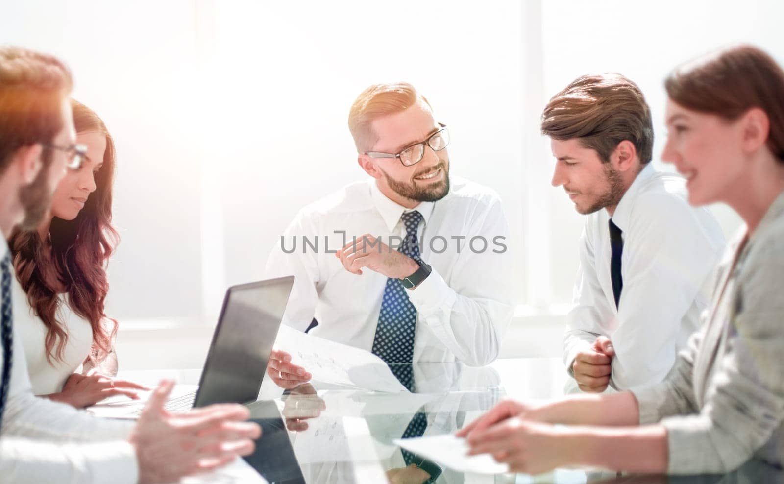 Frustrated business people sitting at the table in office.business concept