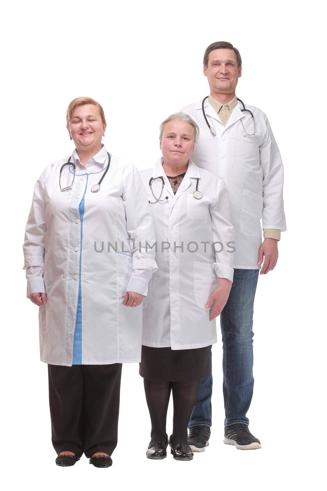 Front view of happy group of medics or doctors at white background. Cconcept of clinic, profession, people, health care and medicine