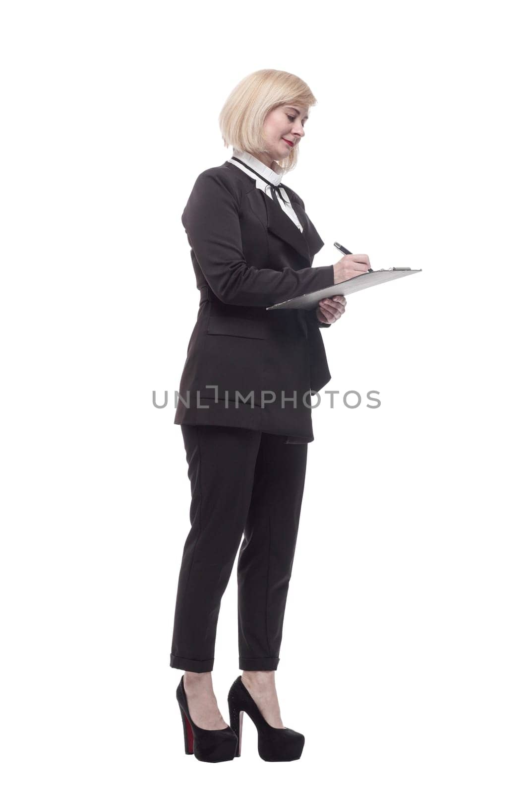 in full growth. confident business woman with a clipboard. isolated on a white background.
