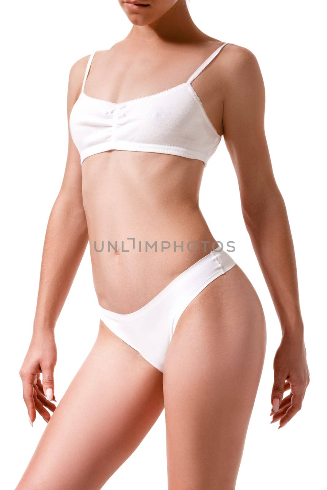 Slim tanned woman's body. Isolated over white background. Diet. Sport. Health