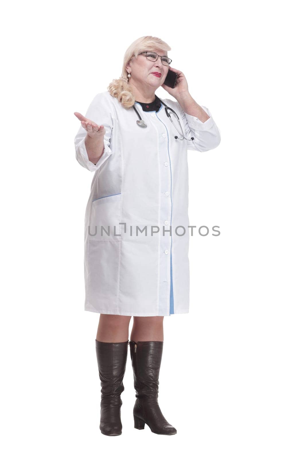 in full growth. attending doctor using her smartphone. isolated on a white background.