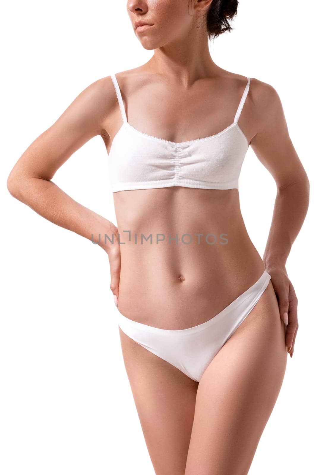 Slim tanned woman's body. Isolated over white background. Diet. Sport. Health
