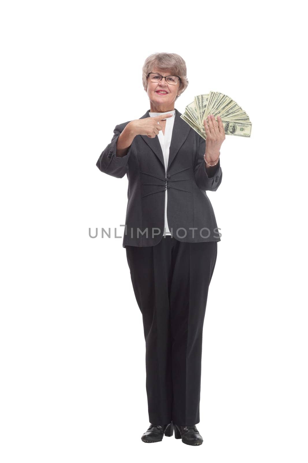 A smiling woman holding dollars with thumb up sign, isolated on white background