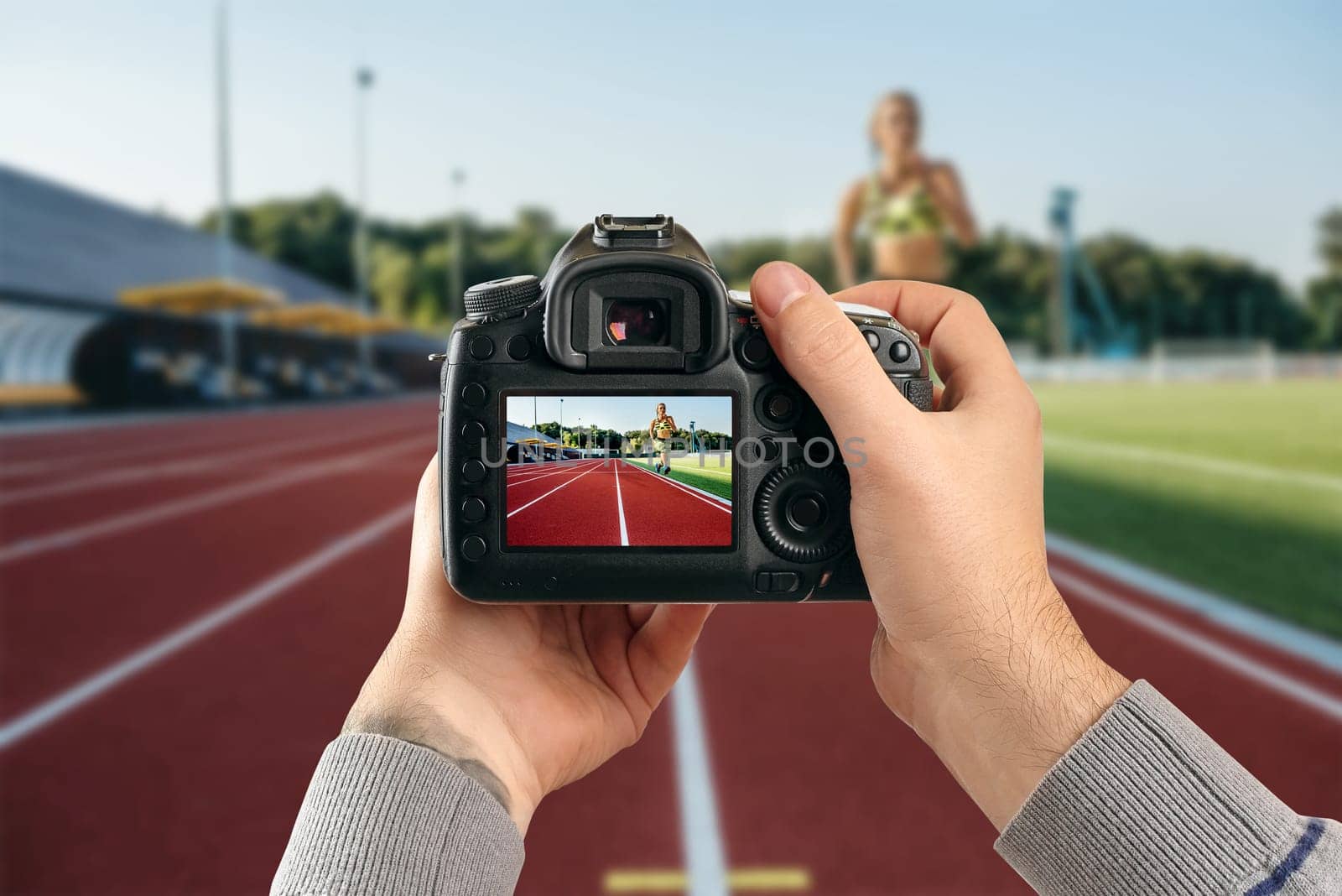 Runner sprinting towards success on run path running athletic track. Goal achievement concept. Female athlete sprinter doing a fast sprint for competition on red lane at an outdoor field stadium.