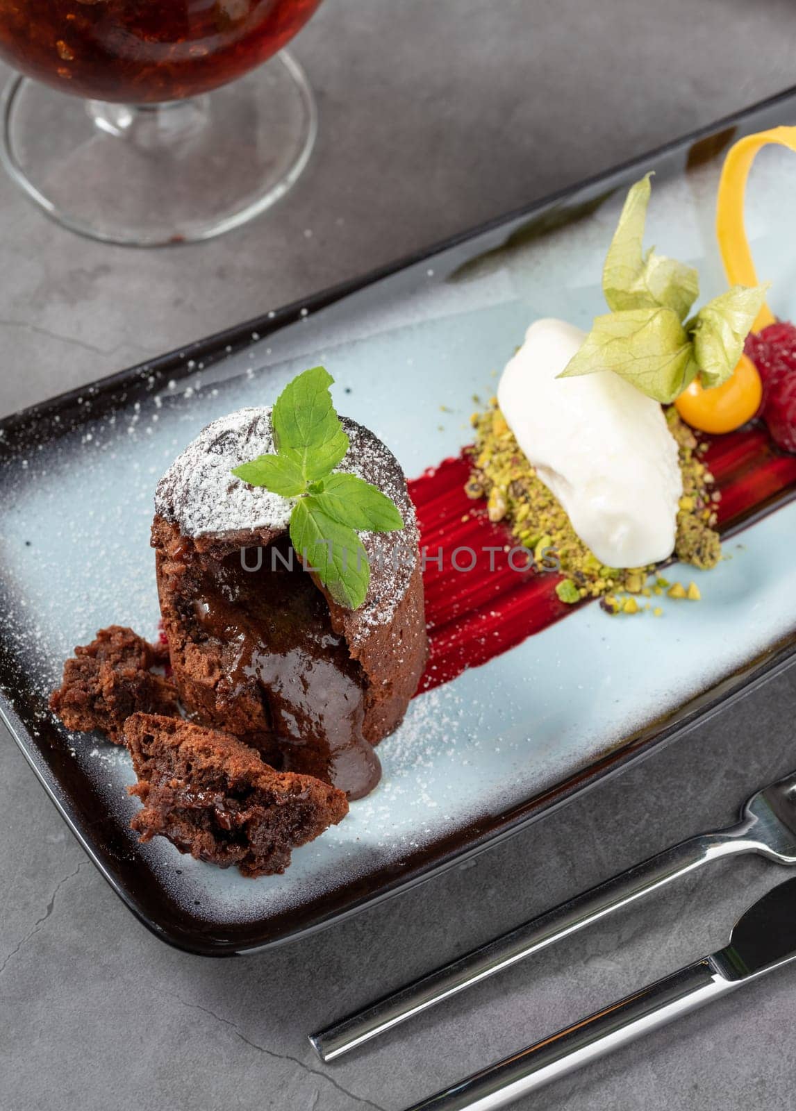 Chocolate souffle with ice cream served in a fine dining restaurant by Sonat