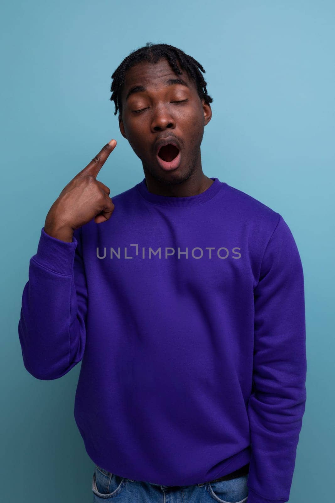 surprised american young man in blue sweatshirt.