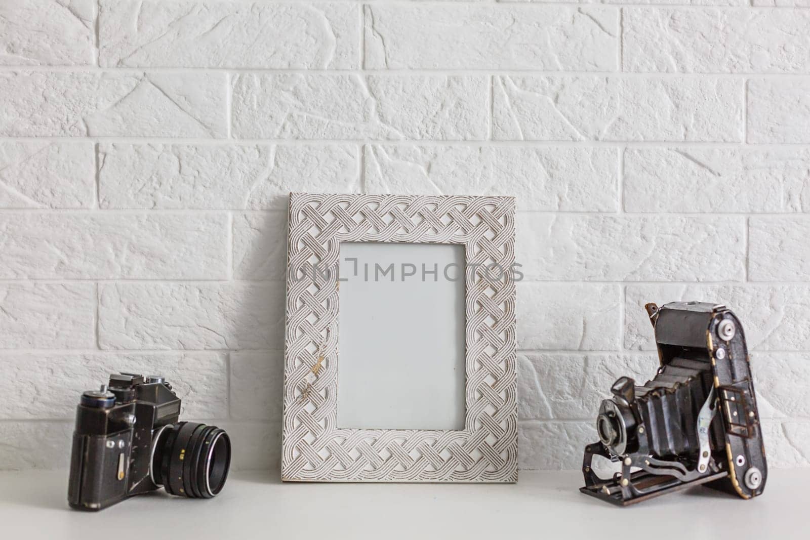 Square simple blank white photo frame on wall