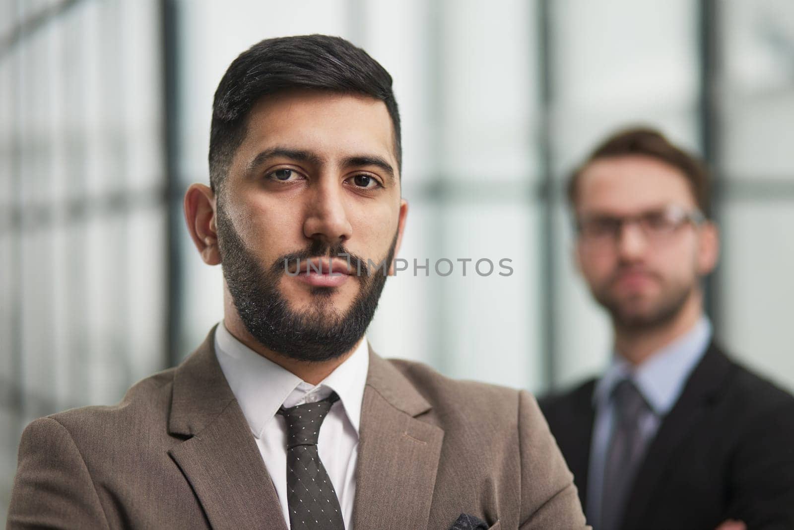 Portrait of casual caucasian male worker looking at camera