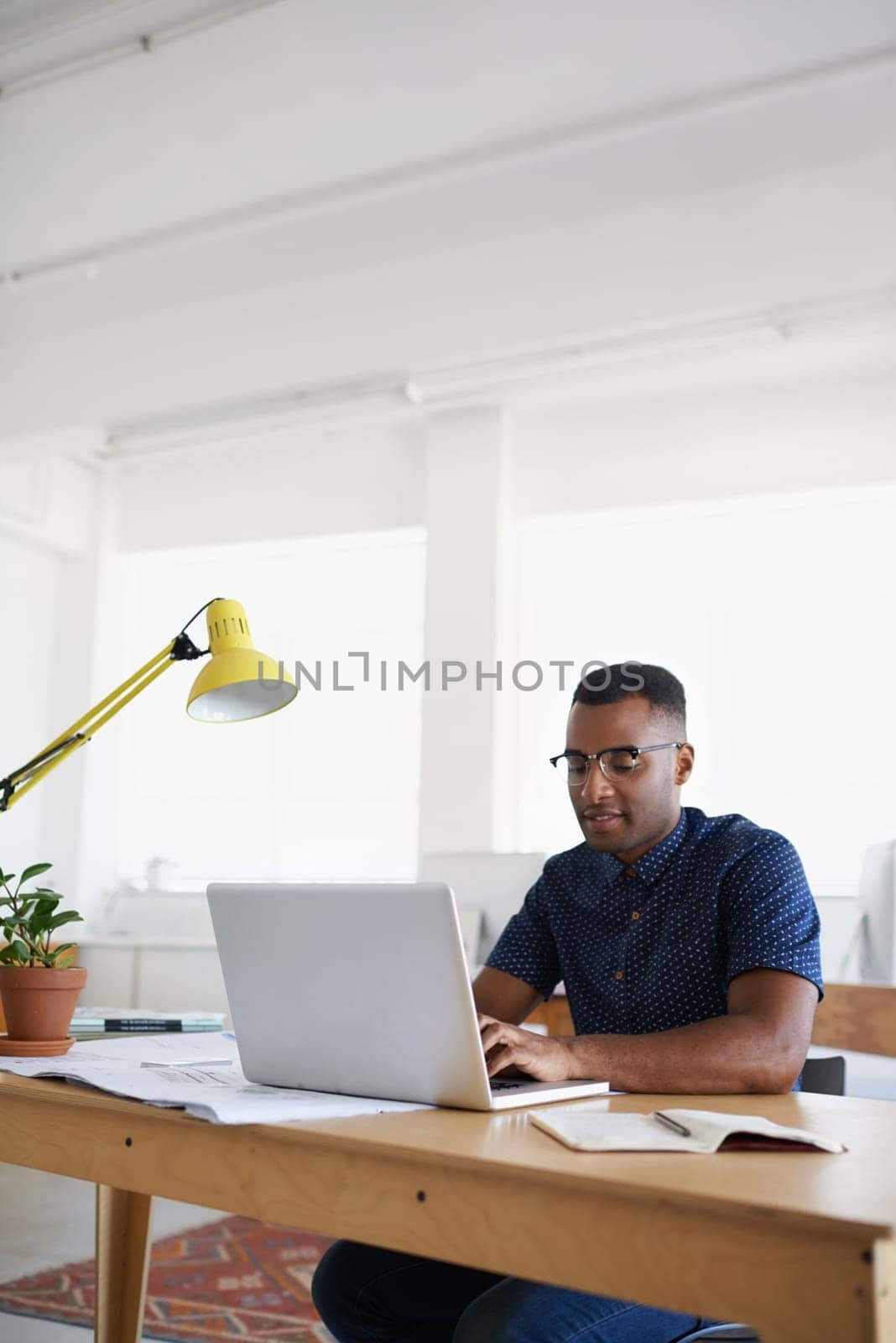 Journalist, typing or black man with laptop for research working on online business or copywriting. Computer, digital agency or focused worker searching for blog content, reports or internet article.