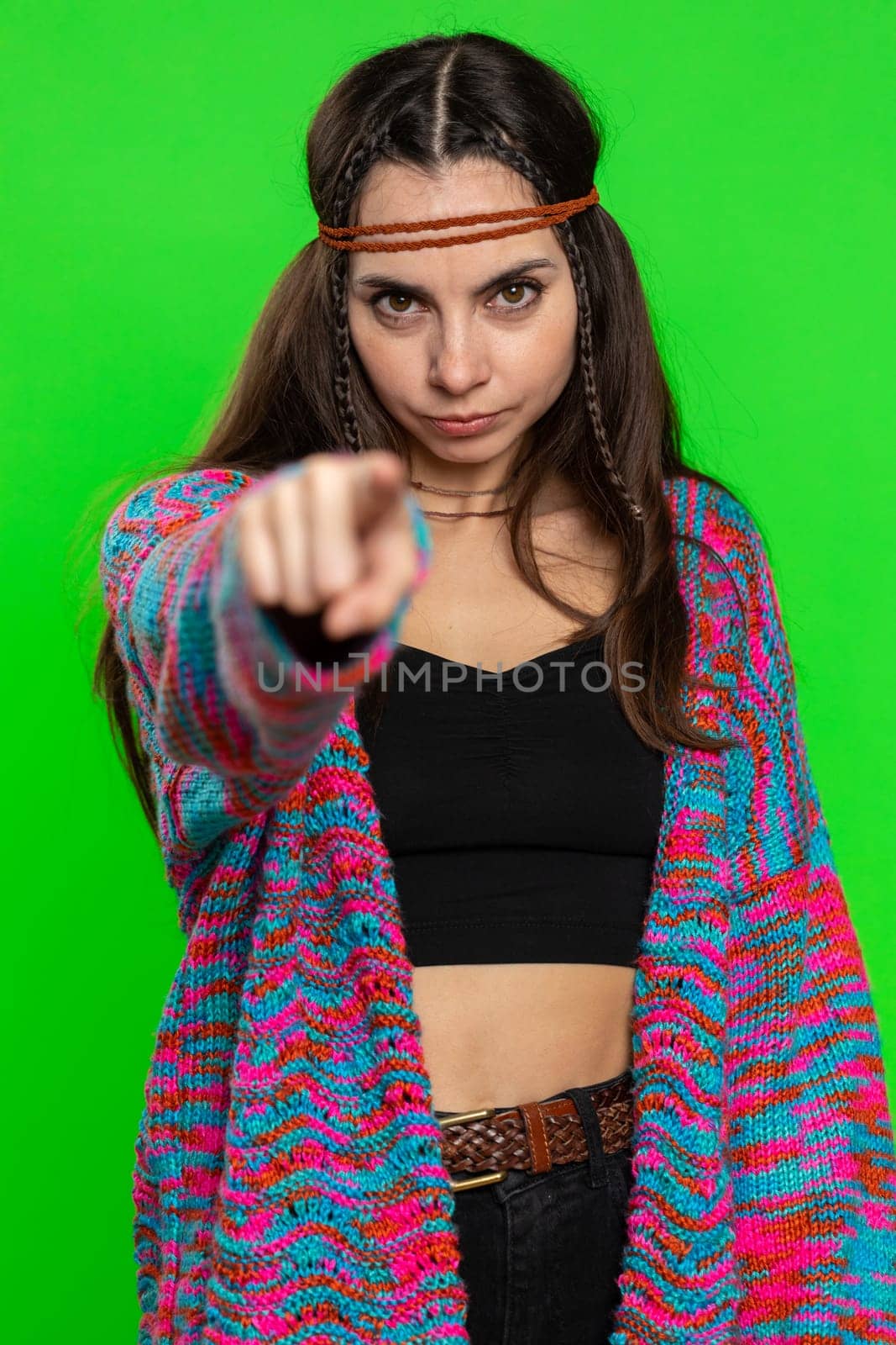 Hey you. Young happy woman smiling excitedly and pointing to camera, choosing lucky happy winner, indicating to awesome you. Pretty hippie girl isolated alone on chroma key background, green screen