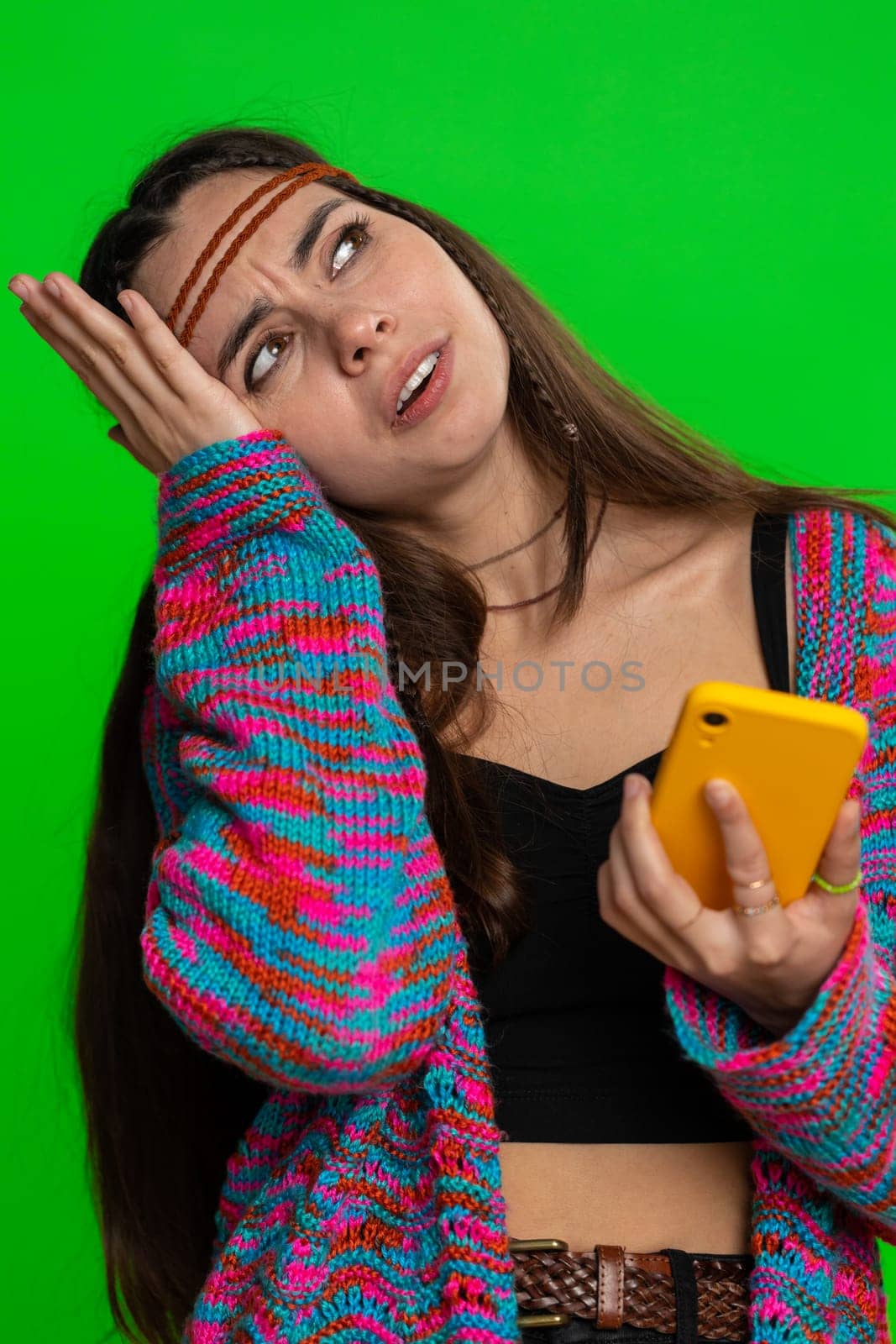 Woman use mobile phone smartphone typing browsing, loses becoming surprised sudden lottery results, bad fortune, loss, fail. Pretty hippie girl isolated on chroma key background, green screen, indoors