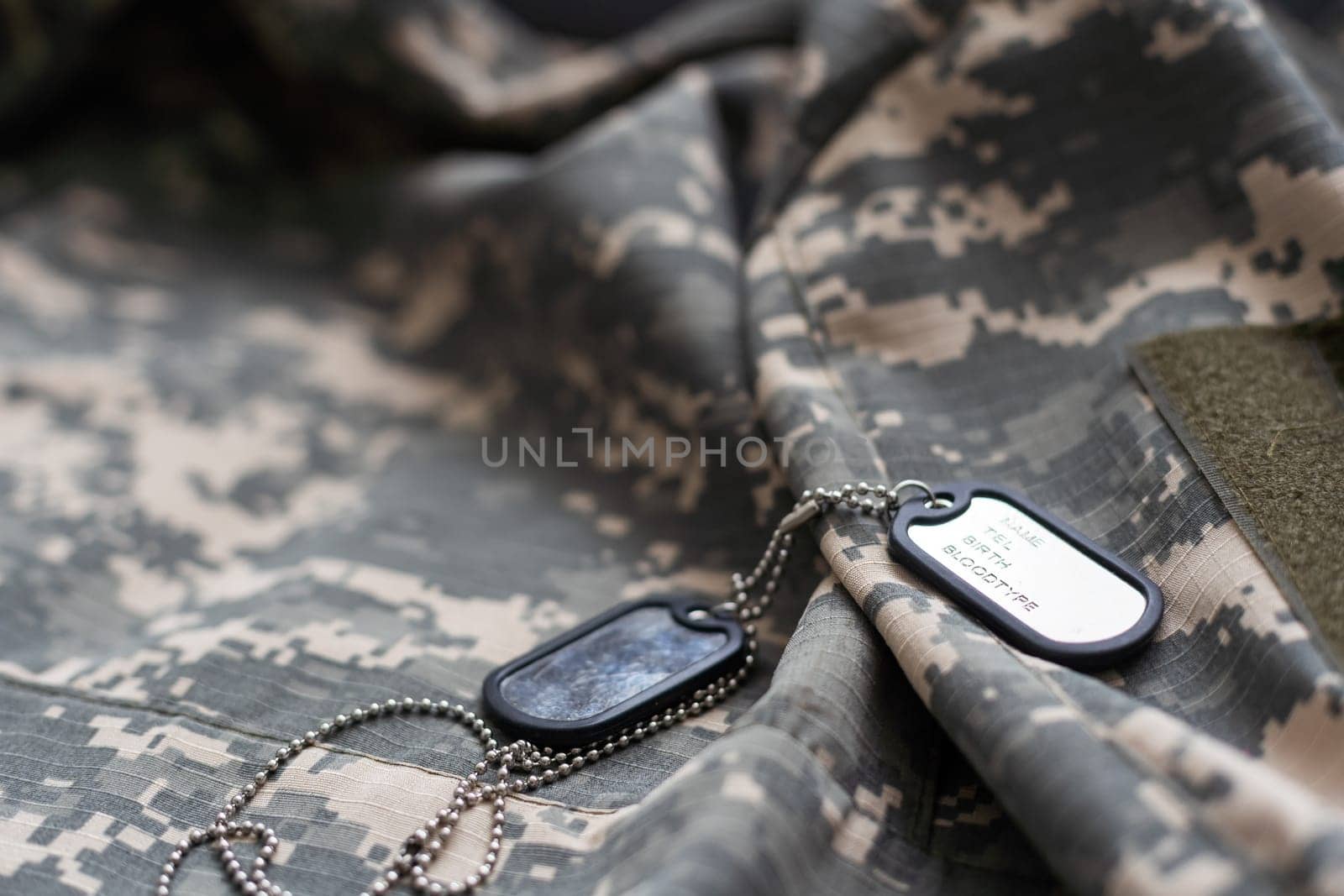 Close-up of the surface of the military uniform of the Ukrainian military.