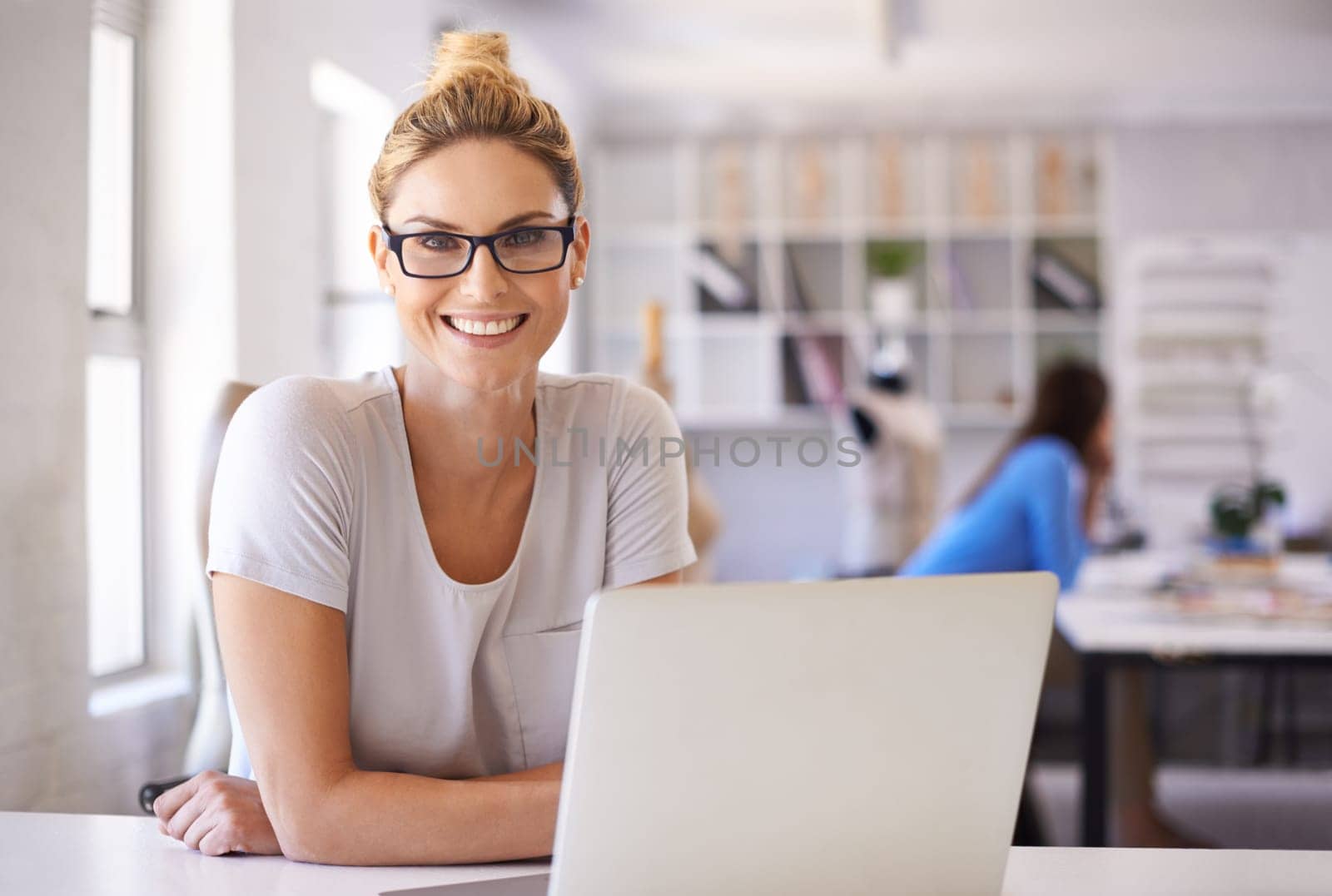 Smile, laptop and fashion designer with portrait of woman for creative, planning and retail. Boutique, small business and internet with female employee in workshop for store, industry and tailor.