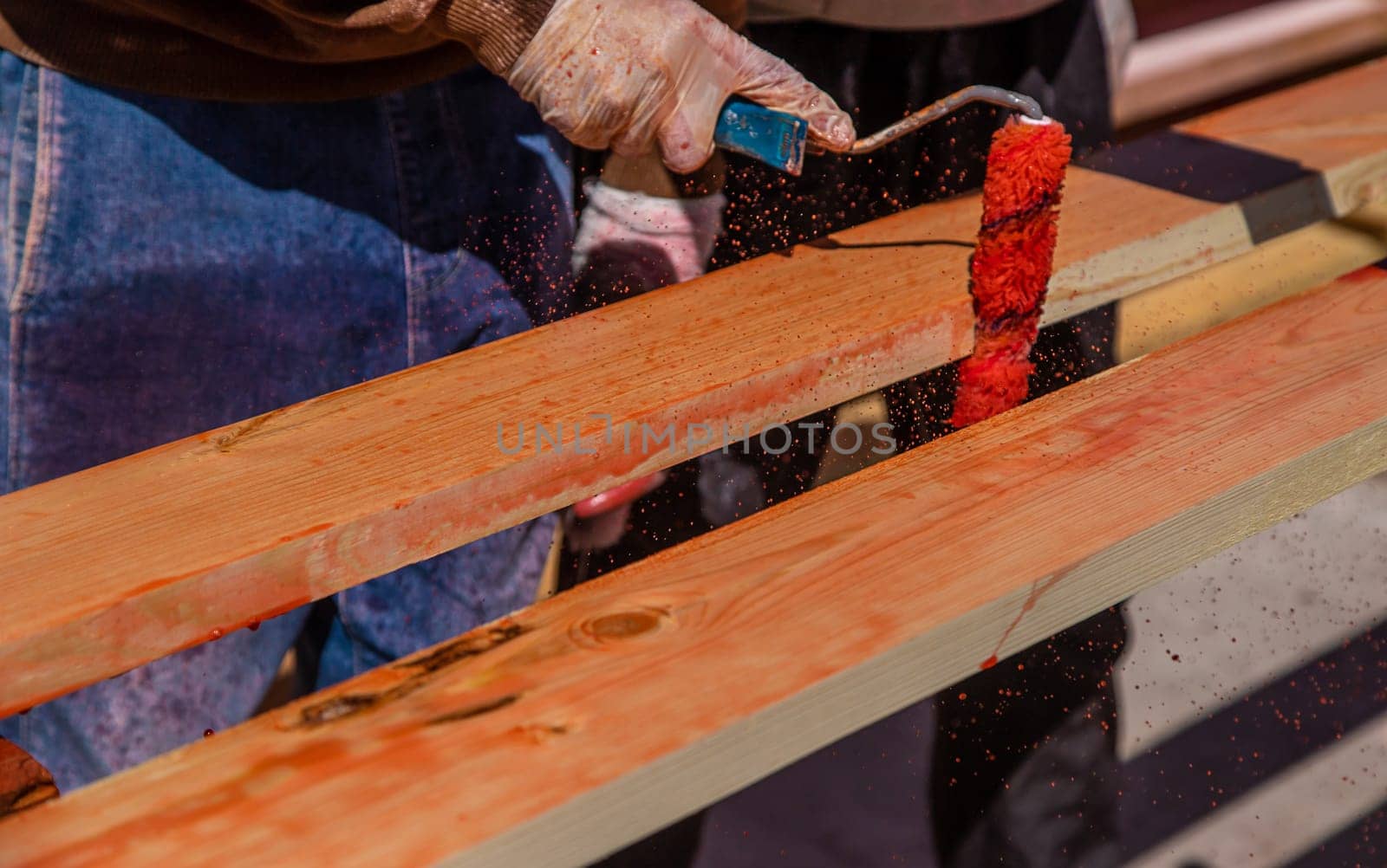 Treat the wooden board with an antiseptic. Selective focus. Nature.