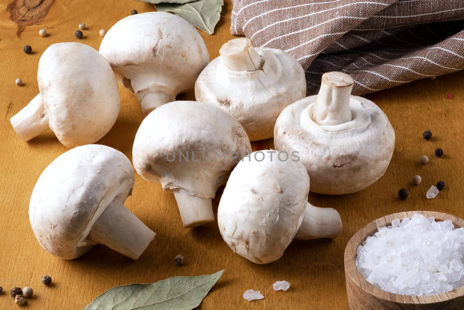 Close-up of champignon mushrooms and spices. Selective focus.