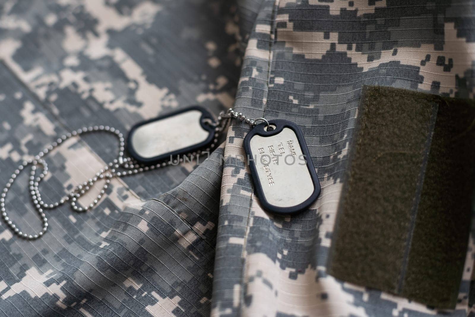 Territorial Defence Forces of Ukraine uniform insignia badge on camouflaged uniform background