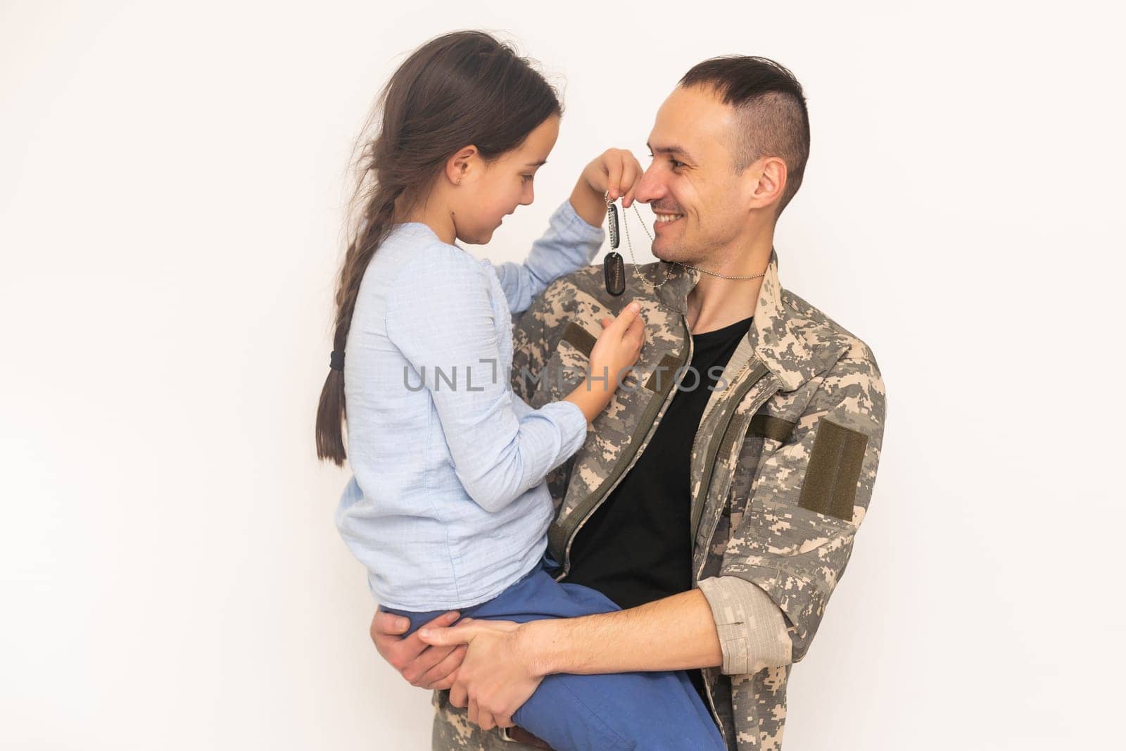 Handsome soldier reunited with family.