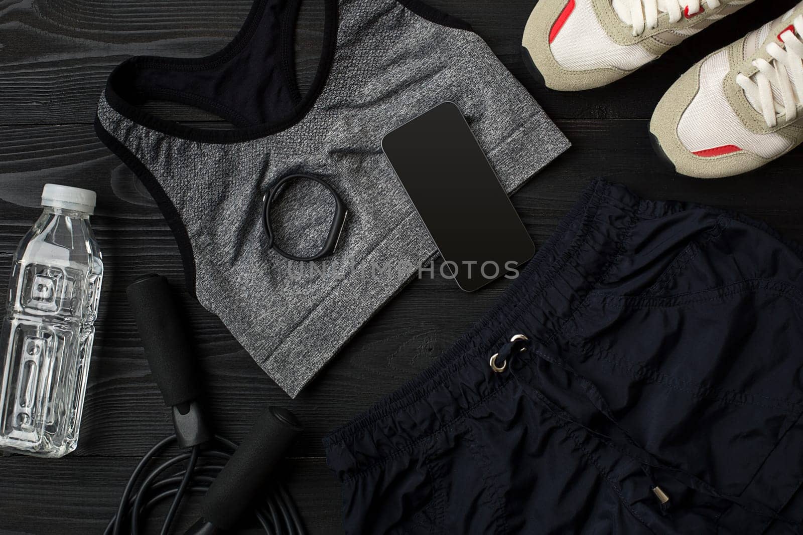 Sports accessories for fitness on the wooden floor. Healthy lifestyle concept. Top view