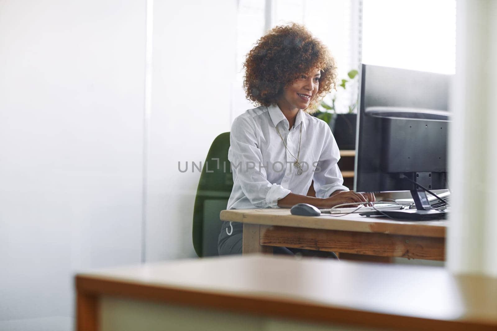 Running with an idea. a beautiful young businesswoman sitting in her office