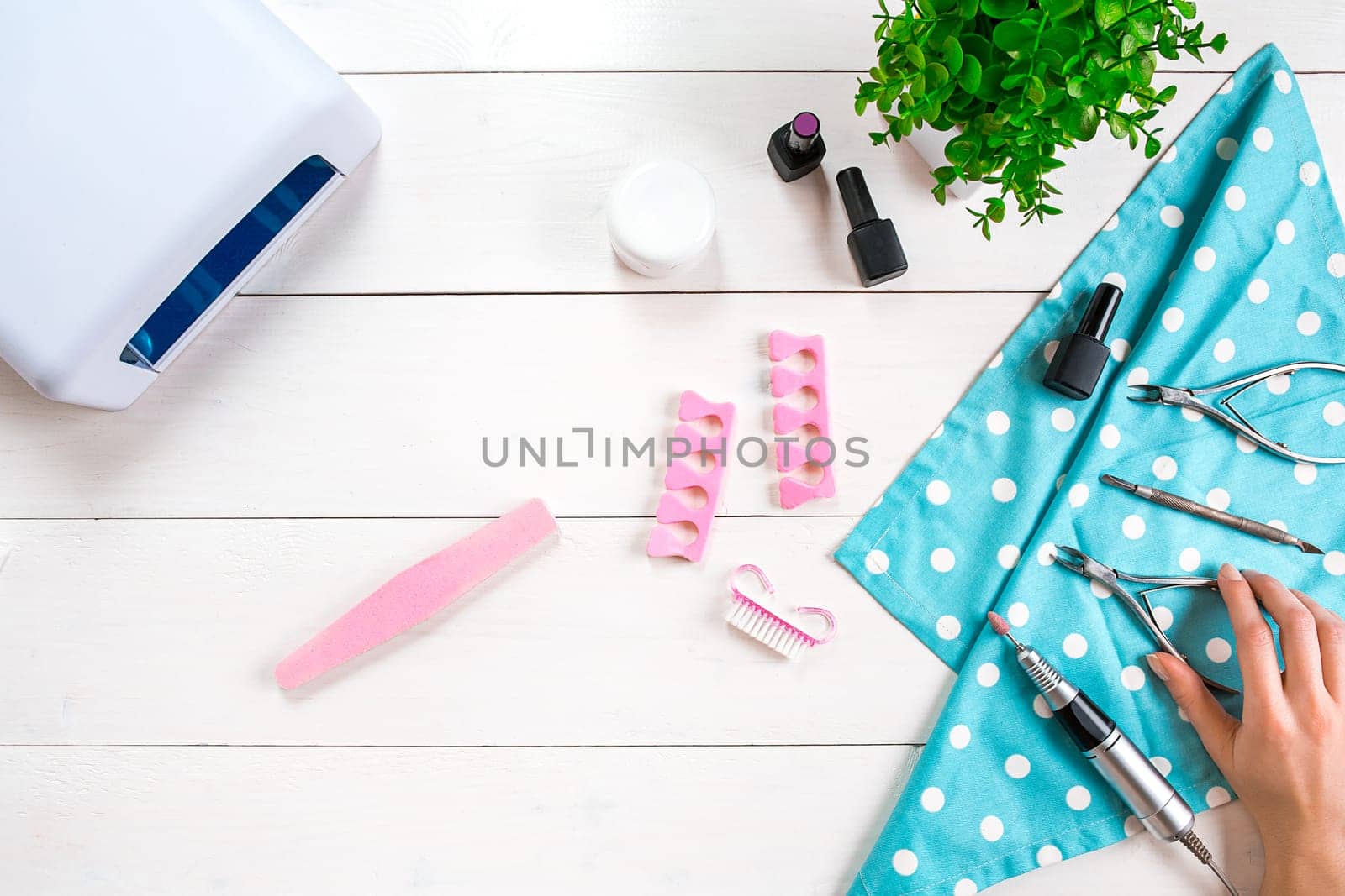 Nail care. Manicure set and nail polish on wooden background. Top view. Manicurist. Manicure for yourself