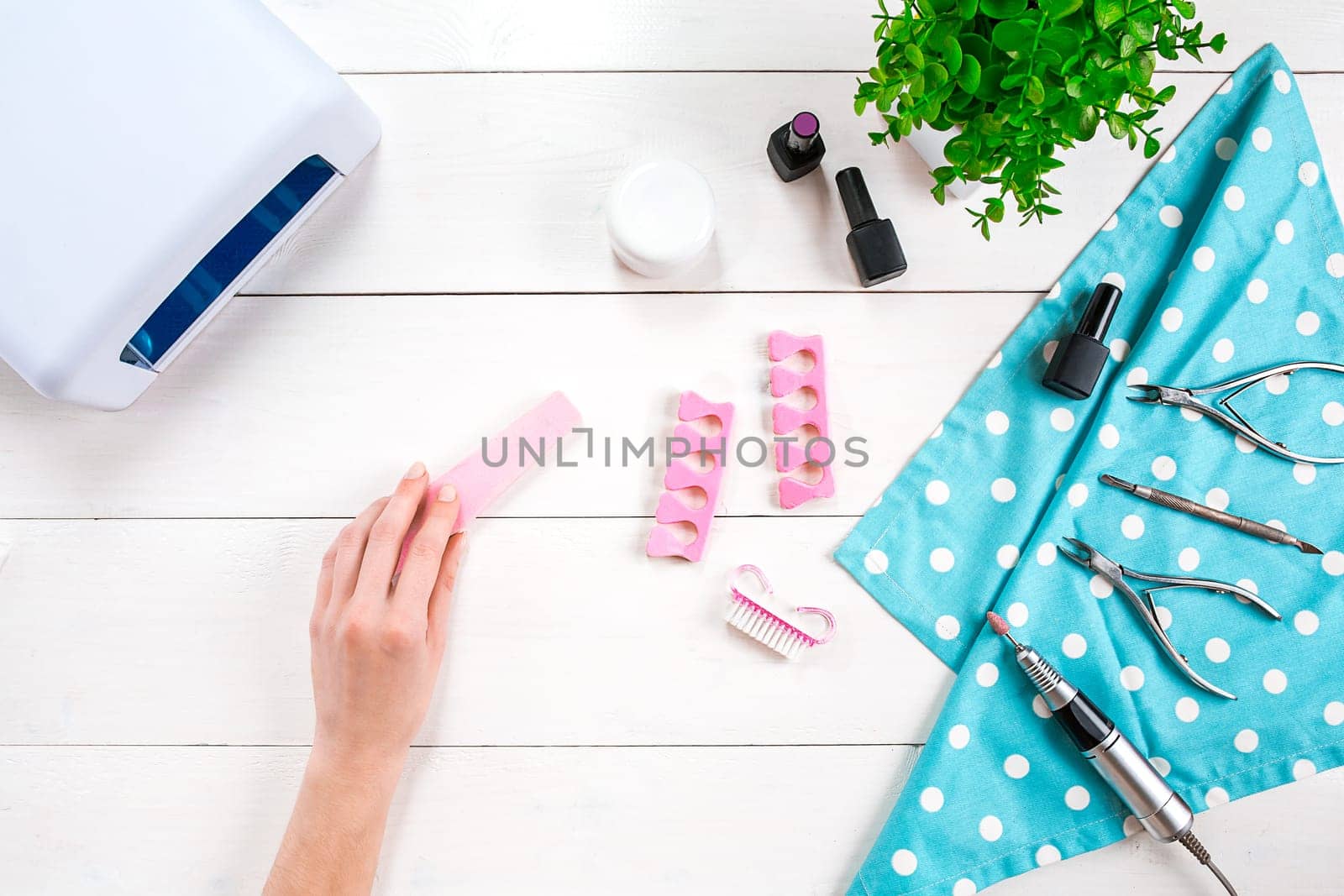 Nail care. Manicure set and nail polish on wooden background. Top view. Manicurist. Manicure for yourself