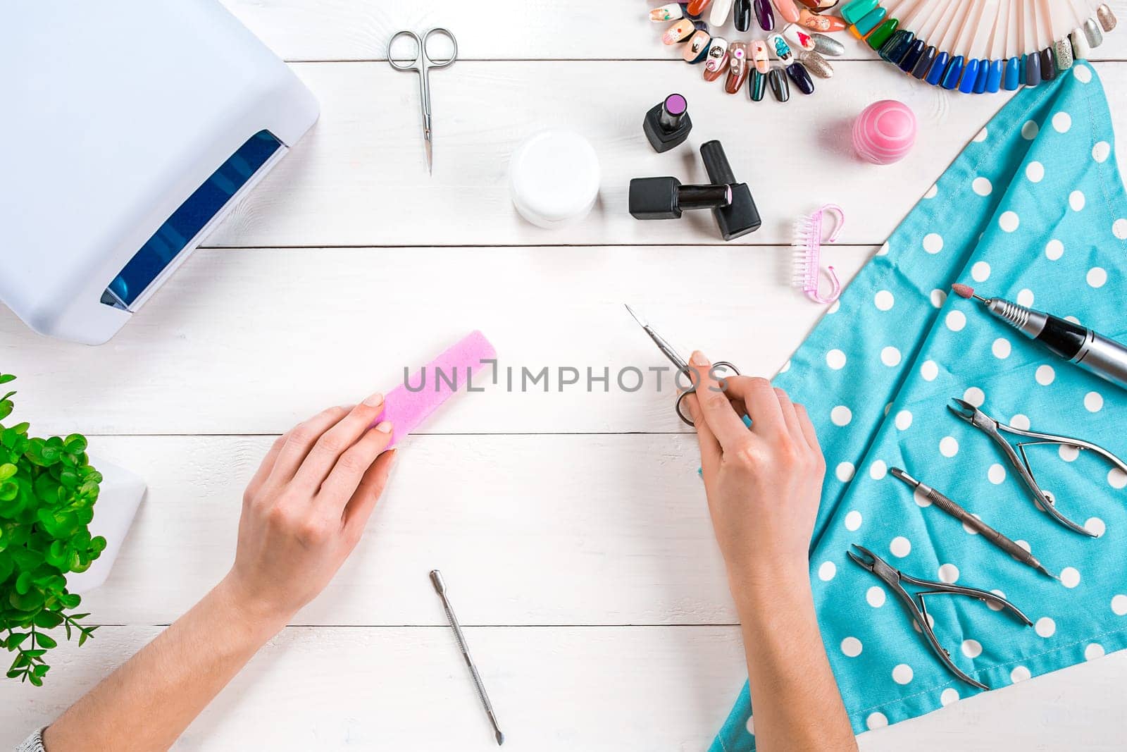 Nail care. Manicure set and nail polish on wooden background. Top view. Manicurist. Manicure for yourself
