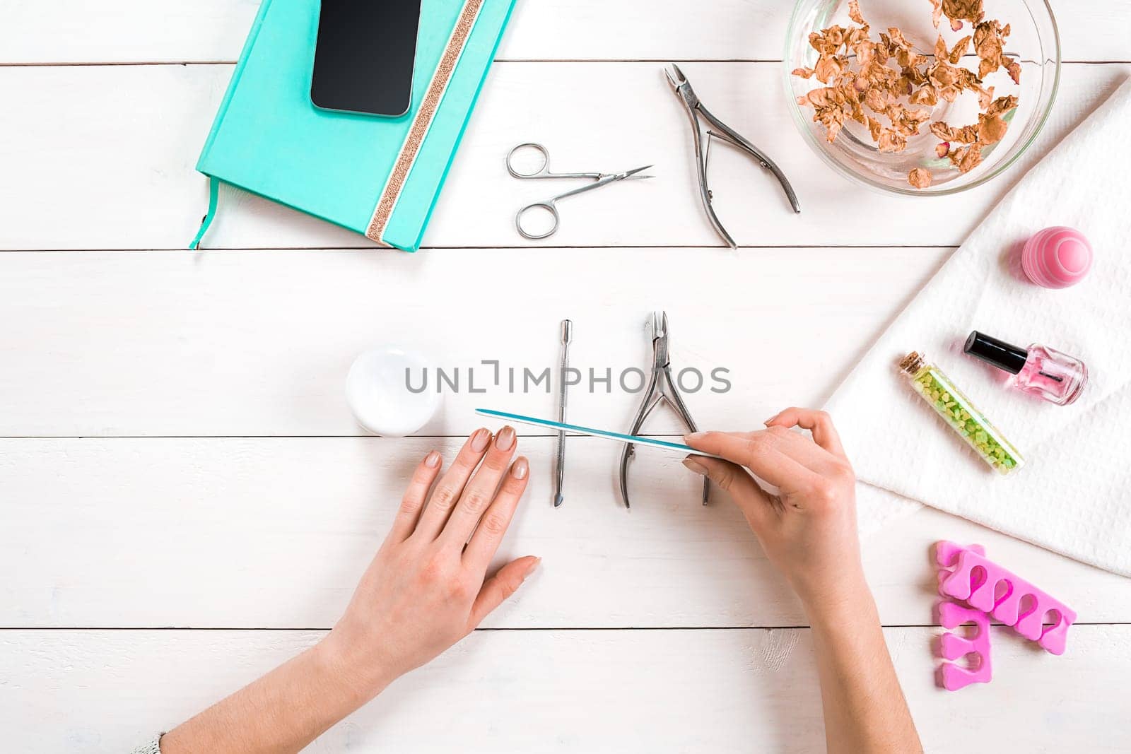 Nail care. Manicure set and nail polish on wooden background. Top view. Manicurist. Manicure for yourself