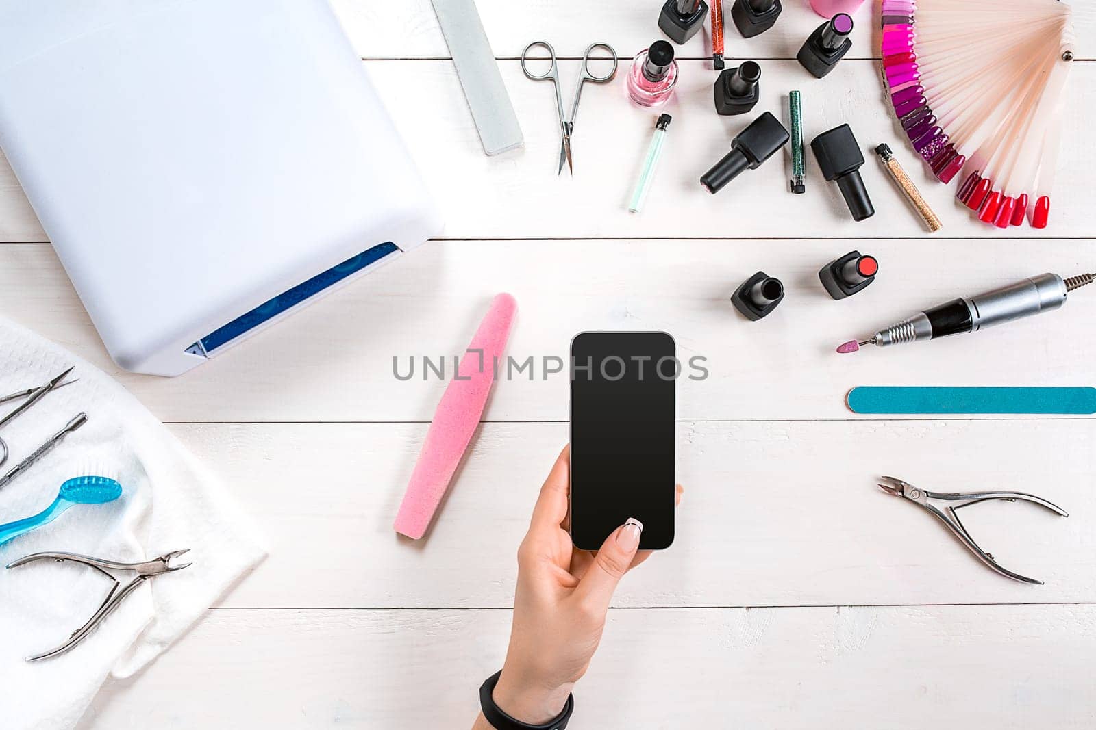 Nail care. Manicure set and nail polish on wooden background. Top view. Manicurist. Manicure for yourself