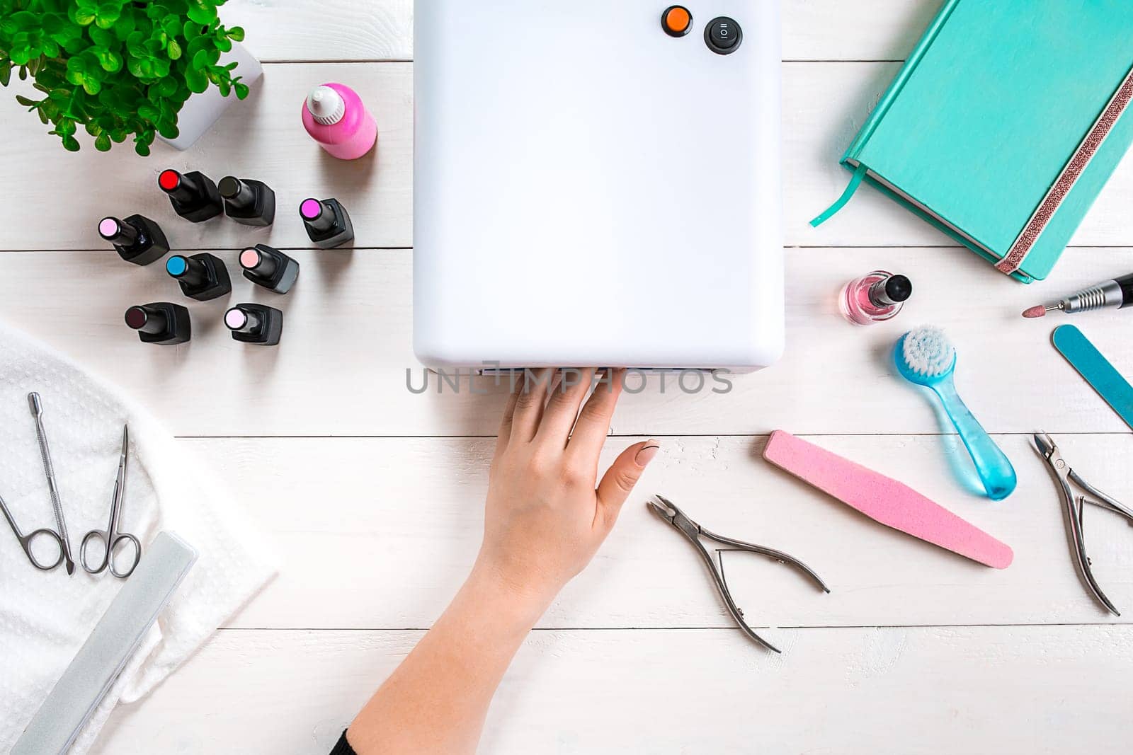 Nail care. Manicure set and nail polish on wooden background. Top view. Manicurist. Manicure for yourself